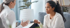 image showing a woman getting advice from a professional doctor for doctor clearance