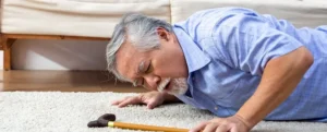 image showing an old man fall and injured while workign at home