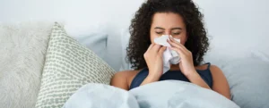 woman having influenza like flu and resting at home