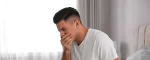man having nausea problem and suffering for the treatment