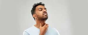 image showing a man having throat pain problem