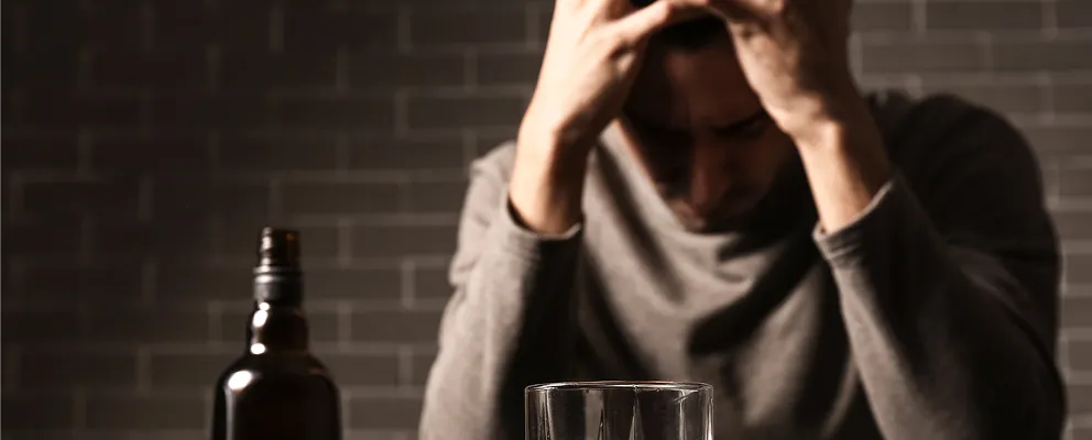 image showing a man suffering from alcohol addiction