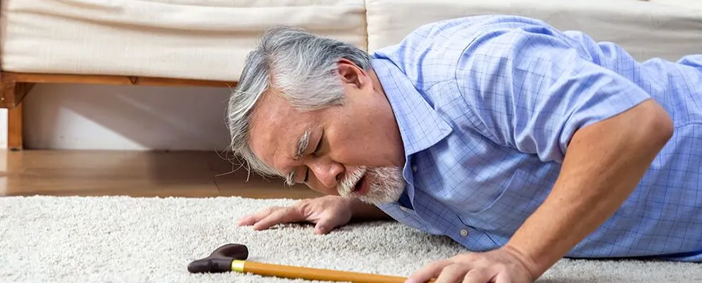 image showing an old man fall and injured while workign at home